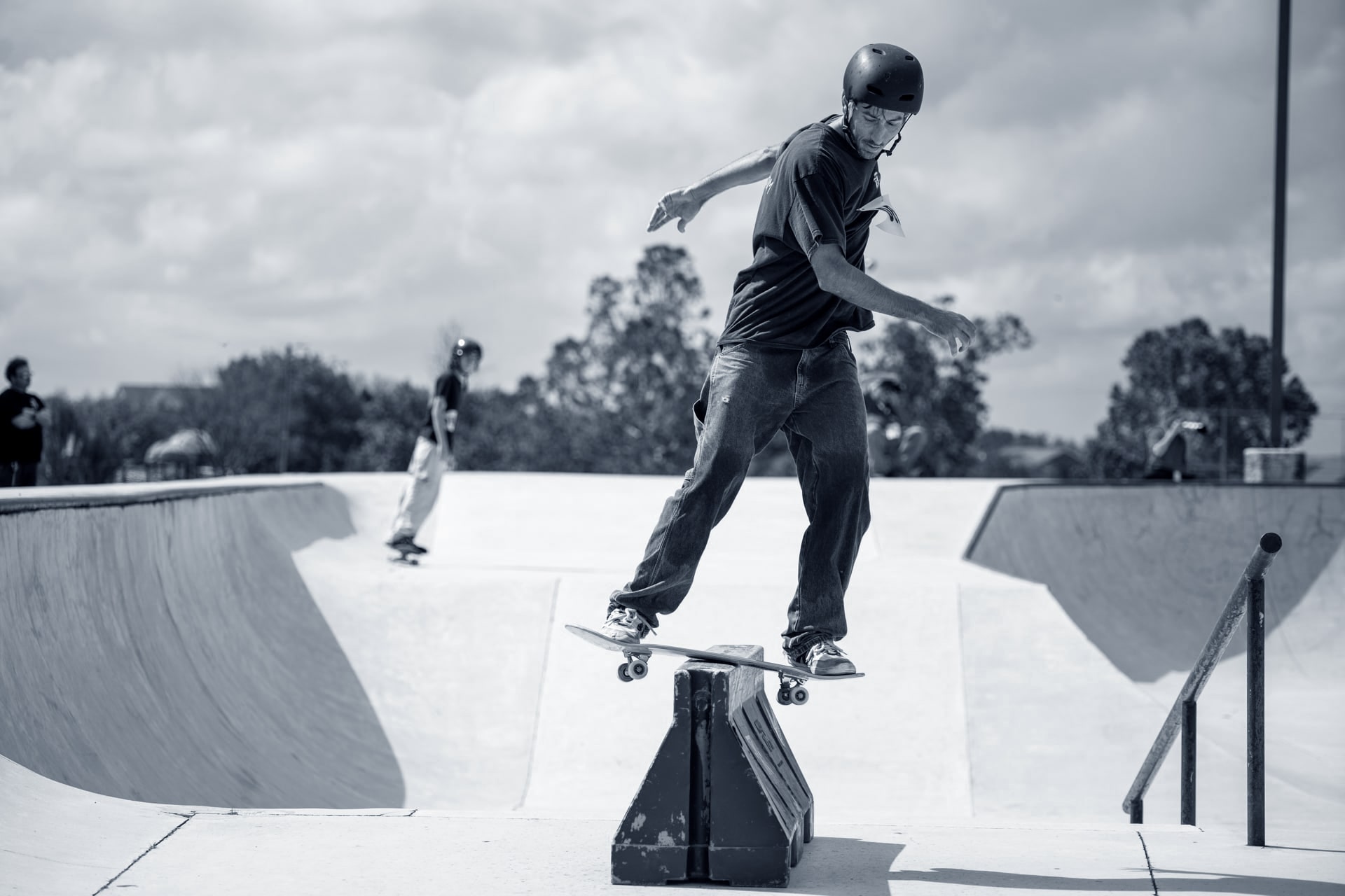 skateboarder grinding on barricade